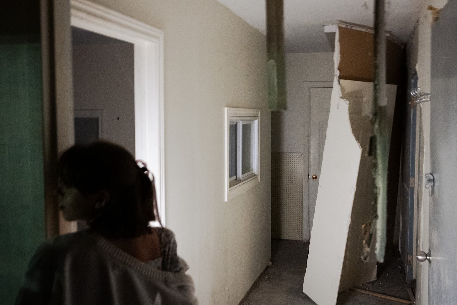 My girlfriend standing in an abandoned boat house